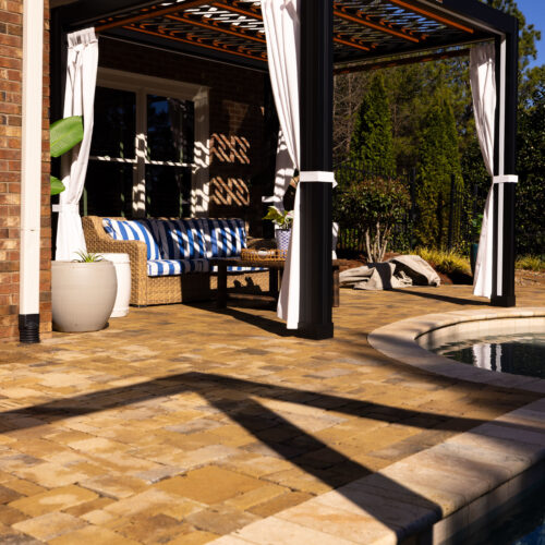 Modern white Cabana X motorized louvered pergola installed poolside at a coastal Delaware home.